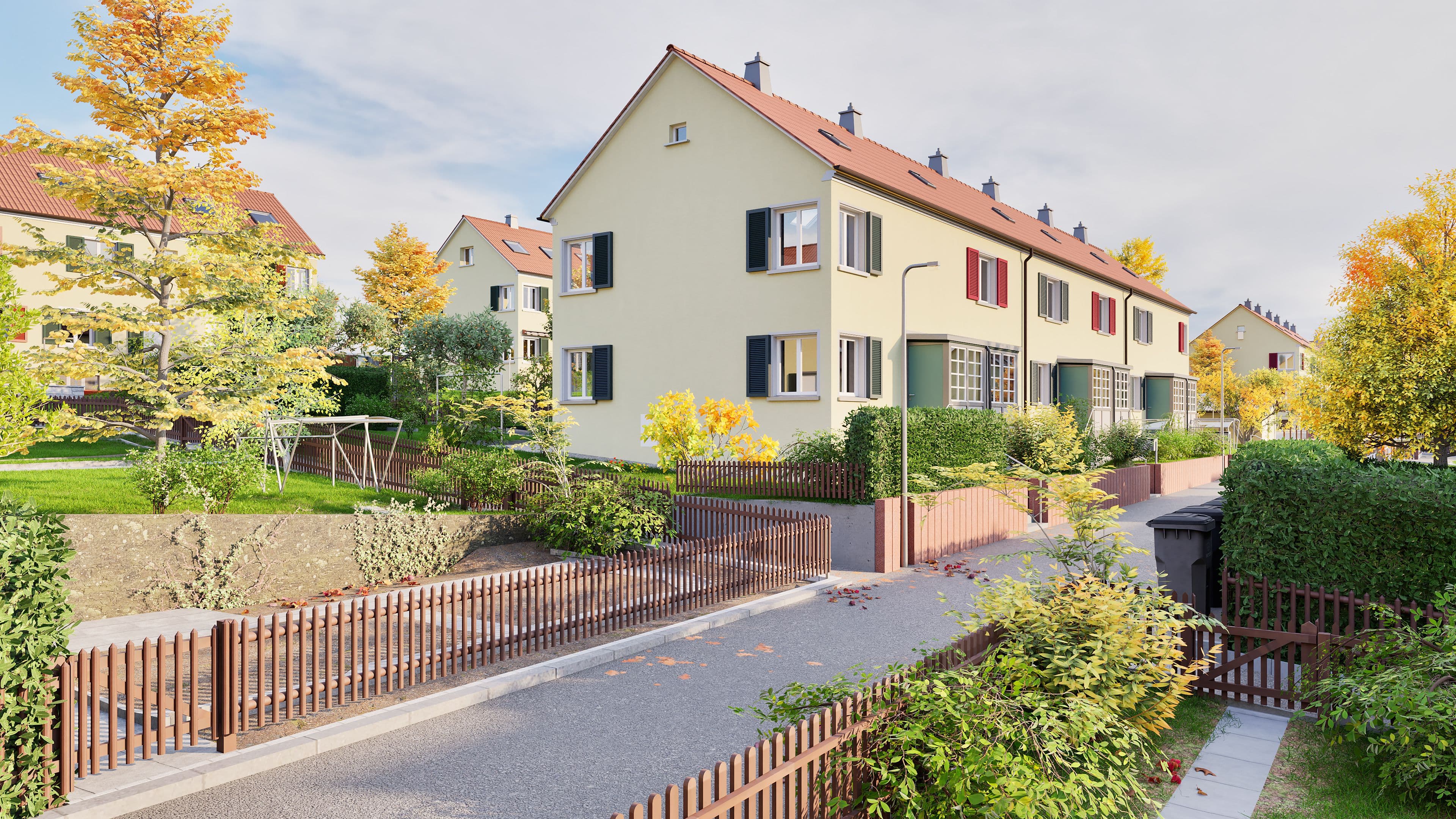 Mehrfamilienhaus im Grünen mit Vorgärten und Spazierweg.