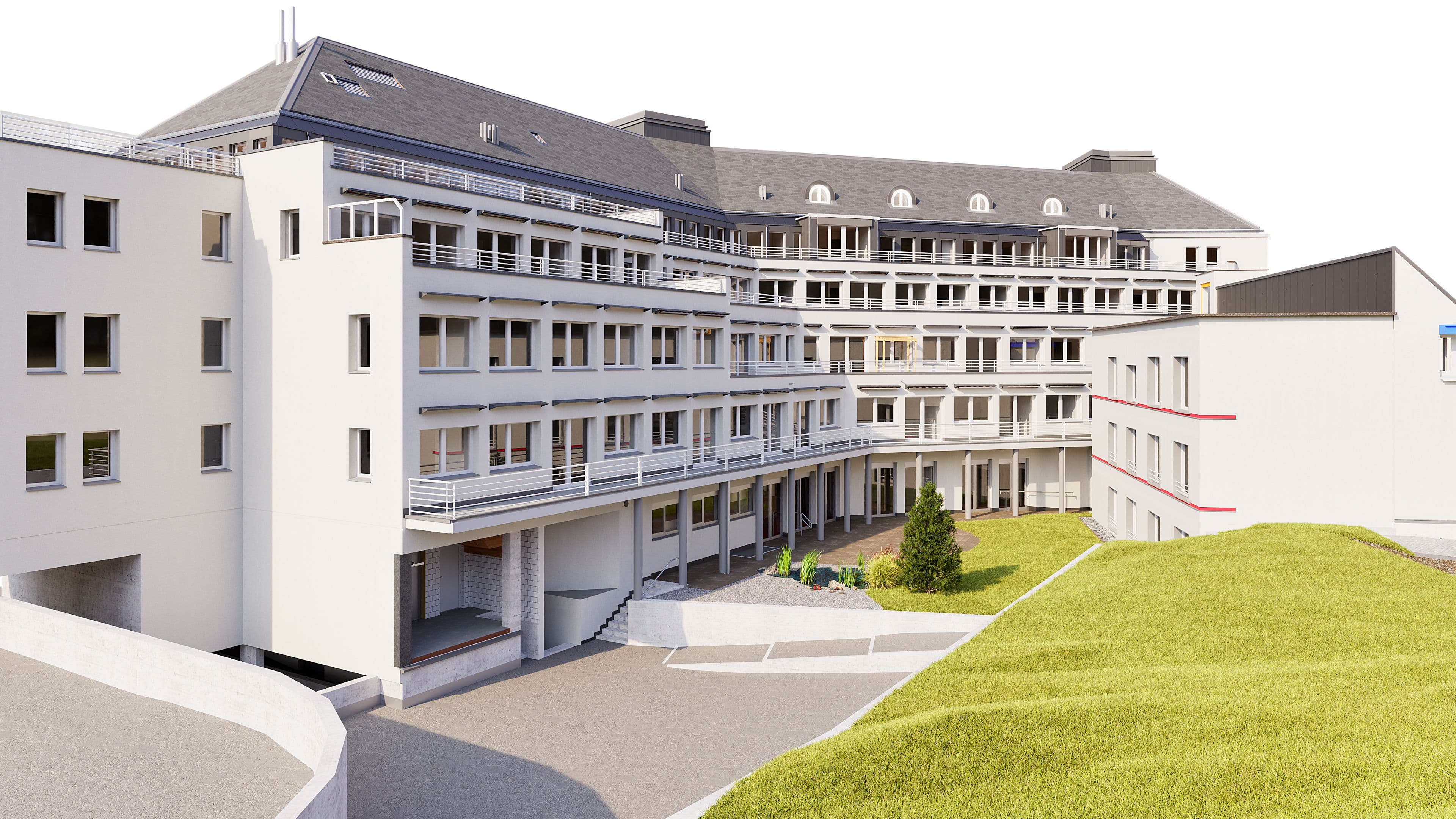 Modernes mehrstöckiges Gebäude mit großen Fenstern und Grünfläche im Vordergrund.