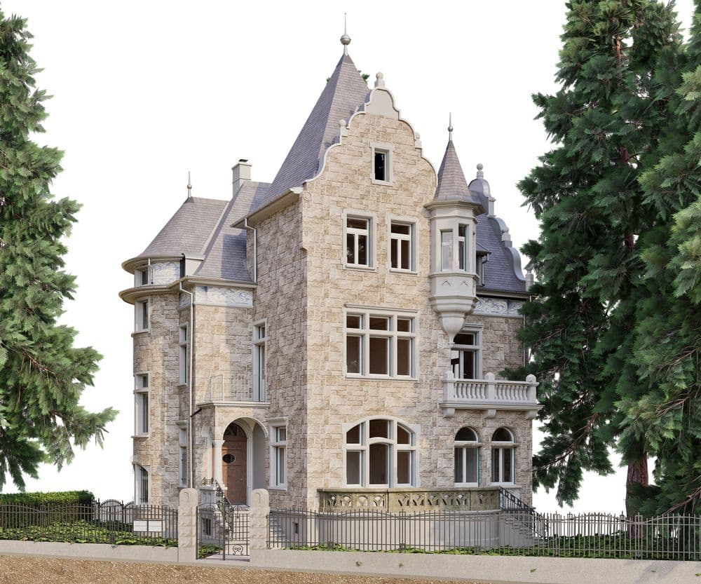 Eine historische Villa mit Erkertürmen und Spitzdach, umgeben von hohen Bäumen, auf einem umzäunten Grundstück.