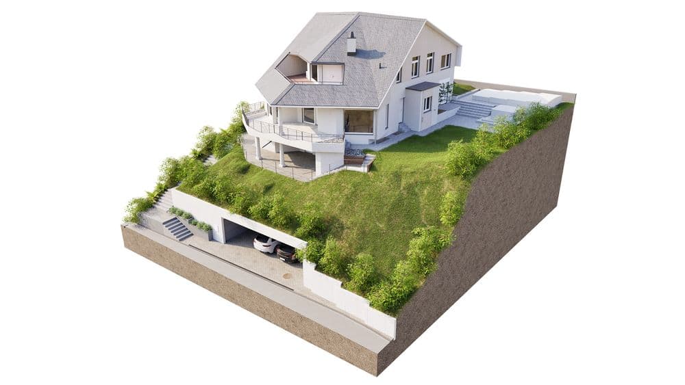 Es handelt sich um ein modernes Haus auf einem grasbewachsenen Hügel, mit einem Carport im Hang.