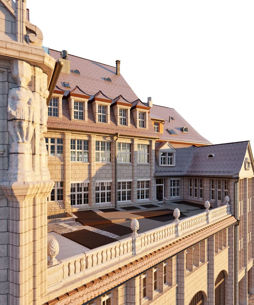 Historisches Gebäude mit detailreicher Architektur und Skulpturen, angestrahlt von warmem Licht.