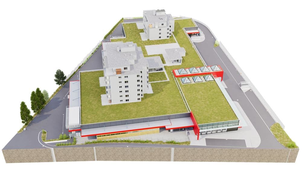 Ein modernes Gebäude mit begrünten Dächern und roten Akzenten, umgeben von Straßen.