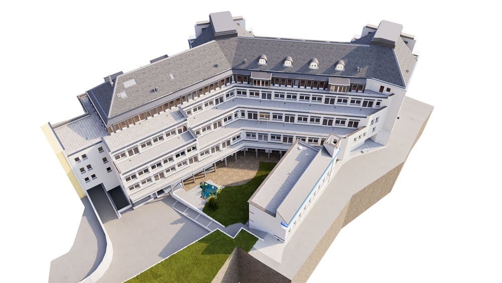 Mehrstöckiges Gebäude mit modernem Design und Innenhof, von oben betrachtet.