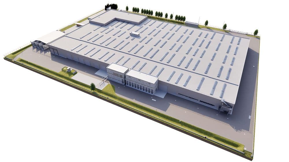Industrielle Lagerhalle mit modernem Flachdachdesign und großflächigem Parkplatz, umgeben von grünen Flächen.