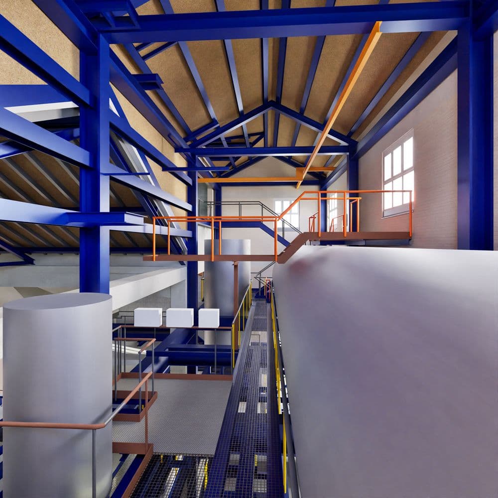 Industrielle Innenansicht mit blauer Stahlkonstruktion, Gitterboden und orangen Geländern, lichtdurchfluteter Raum.