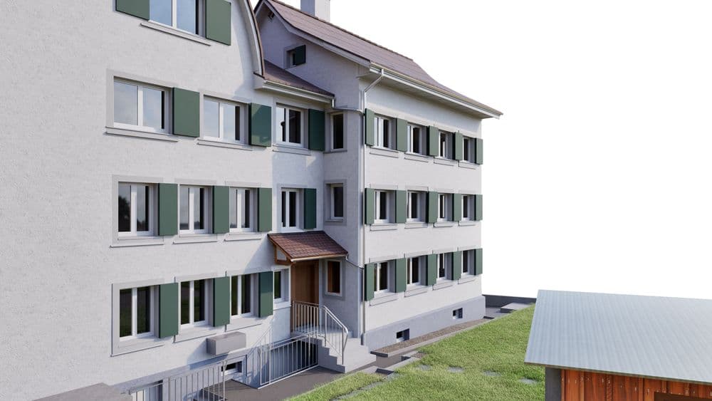 Mehrstöckiges Wohnhaus mit heller Fassade, grünen Fensterläden und zentralem Eingangsbereich mit Treppe; Außenansicht mit Rasenfläche und kleinem Nebengebäude.