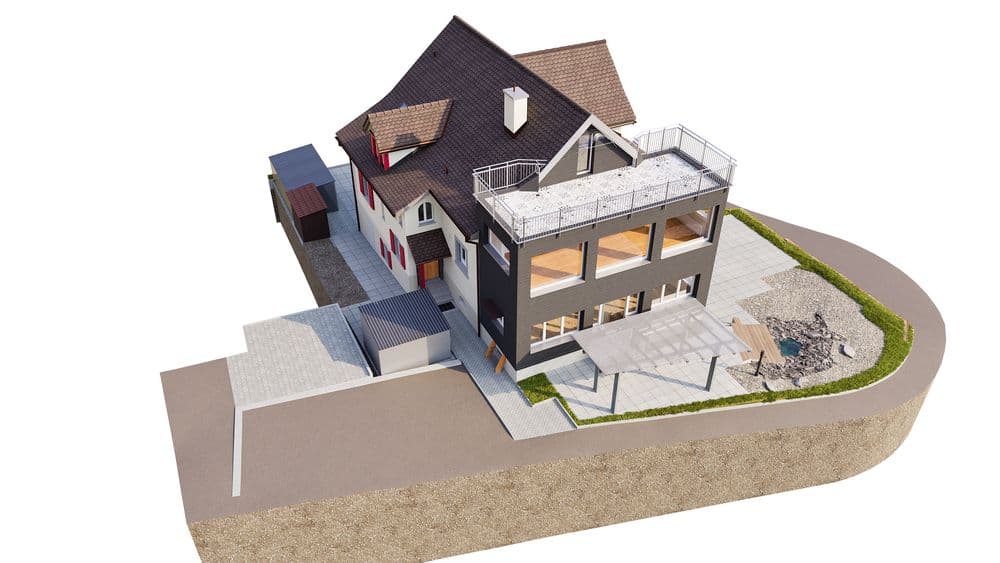 Es handelt sich um ein modernes, mehrstöckiges Gebäude mit Satteldach, Terrasse und umliegendem Weg.